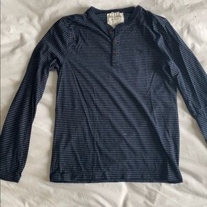 Blue striped, three button, long sleeve shirt